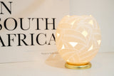 The Leaves Ostrich Egg Tealight Holder from Leo & Stripes