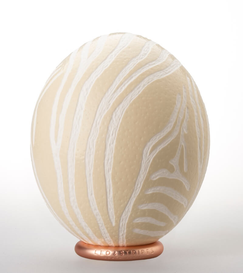 The Bold Zebra Carved Ostrich Egg Ornament from Leo & Stripes