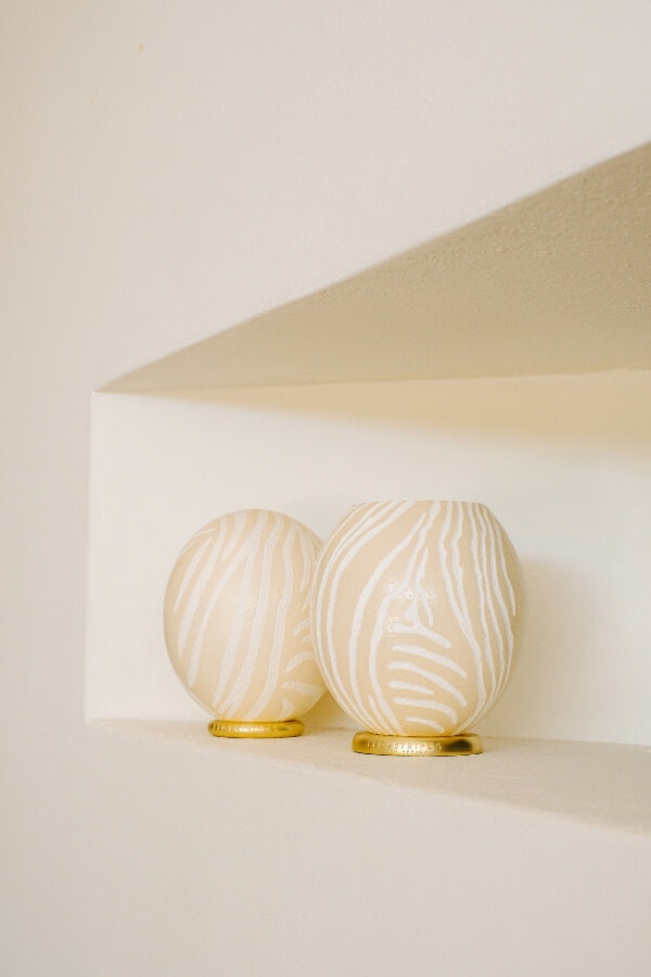 The Bold Zebra Carved Ostrich Egg Ornament from Leo & Stripes