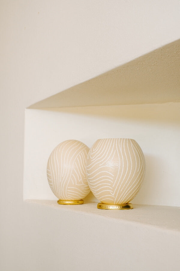 The Fine Zebra Carved Ostrich Egg Ornament from Leo & Stripes